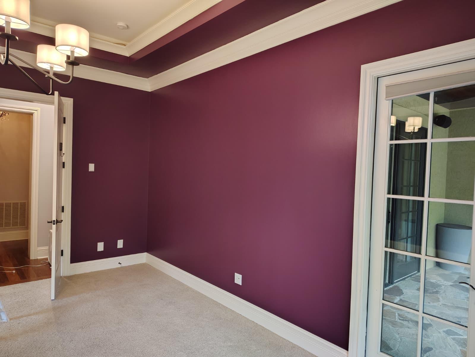 Interior painting project with clean cut-in lines around doors and windows
