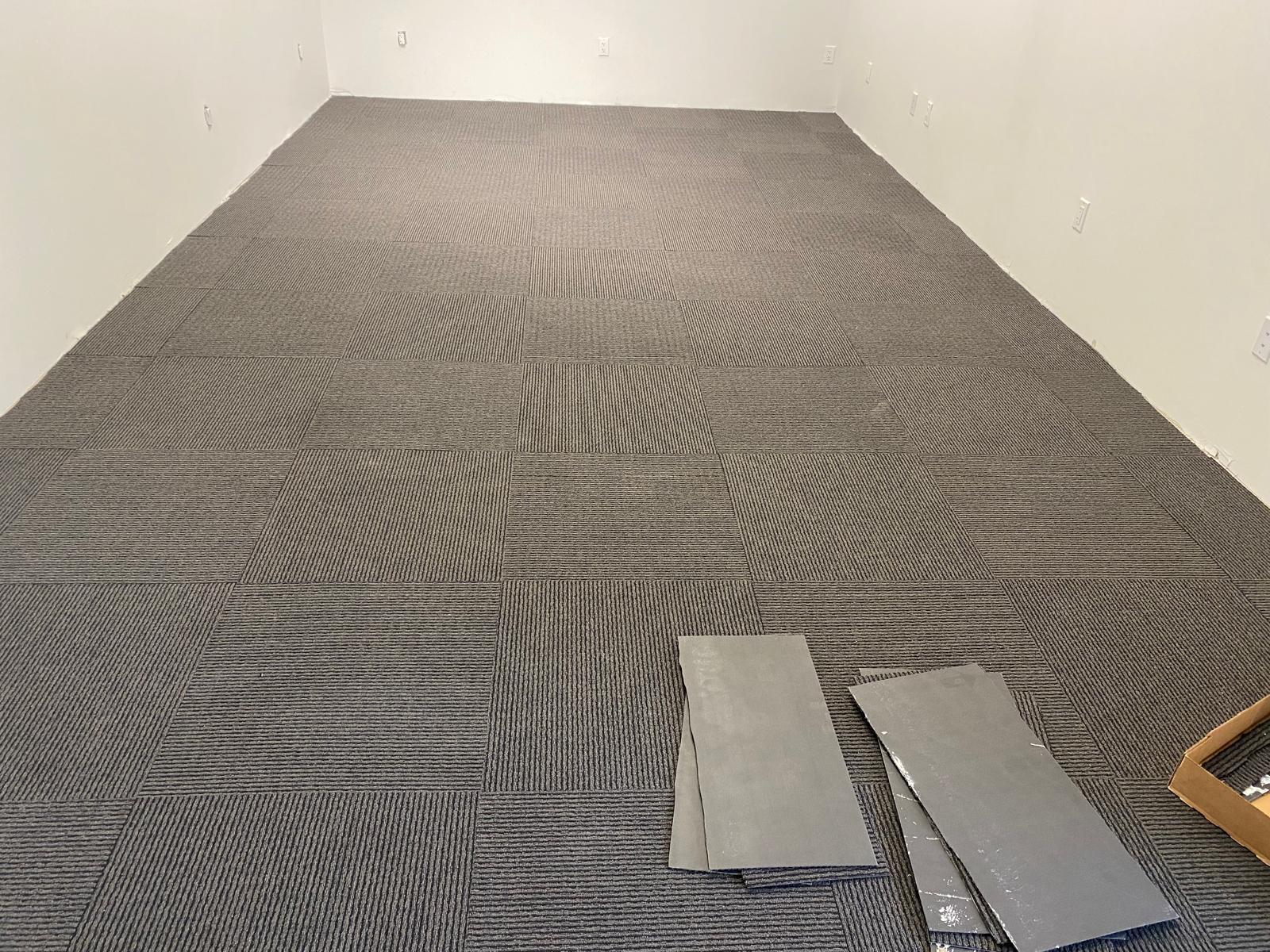 Commercial carpet tile installation completed in an office room