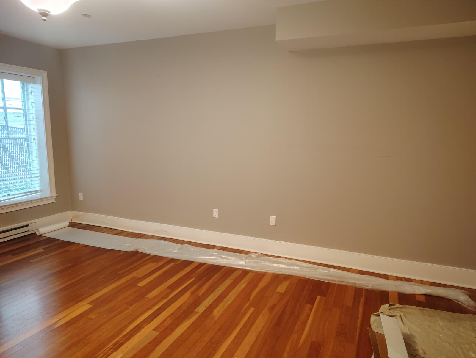 Room with wall base cleaned and treated, ready for new baseboard installation